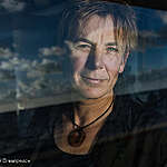 Videographer Myrthe Verweij at the bridge of the Rainbow Warrior in the North Pacific Ocean.