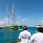 Local Marshallese women's group dance and perform cultural songs at the Rainbow Warrior welcome ceremony in Majuro.
The Rainbow Warrior is in the Marshall Islands, marking the start of a six-week mission around the Pacific nation to elevate calls for nuclear and climate justice; and support independent scientific research into the impacts of decades-long nuclear weapons testing by the US government.
Escorted by traditional canoes, and welcomed by Marshallese singing and dancing, the arrival of the Rainbow Warrior marks a significant moment in the shared history of Greenpeace and the Marshall Islands — 40 years since Greenpeace crew evacuated over 300 people from the Rongelap atoll to Mejatto island, after toxic nuclear fallout from the Castle Bravo test rendered their ancestral lands uninhabitable.