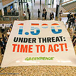 Greenpeace reveals banner inside UN venue at Bonn Climate Conference, calling for stronger action on the 1.5 degree limit