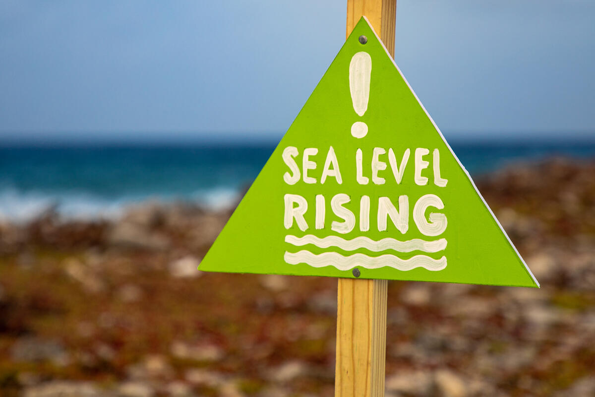 A pole with a lifejacket and a warning sign that reads 'Sea Level Rising' stands on the south side of the beach of Bonaire. Greenpeace Netherland started a campaign to draw attention to the consequences of climate change on Bonaire. Bonaire is being hit hard by climate change, while the island's emissions are many times lower than those of the European part of the Netherlands. By placing lifejackets on poles along the coastline, the organization draws attention to the risks of global warming.