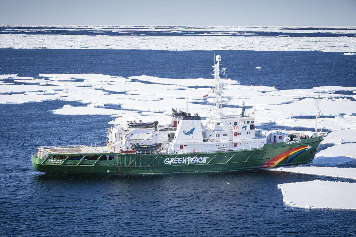 Aerial view of Greenpeace ship the Arctic Sunrise mooring at the ice in Tempelfjorden on Svalbard.