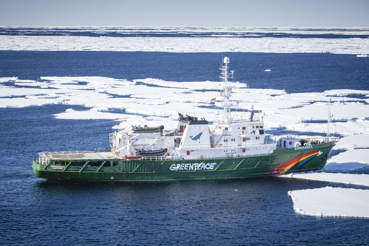 Aerial view of Greenpeace ship the Arctic Sunrise mooring at the ice in Tempelfjorden on Svalbard.