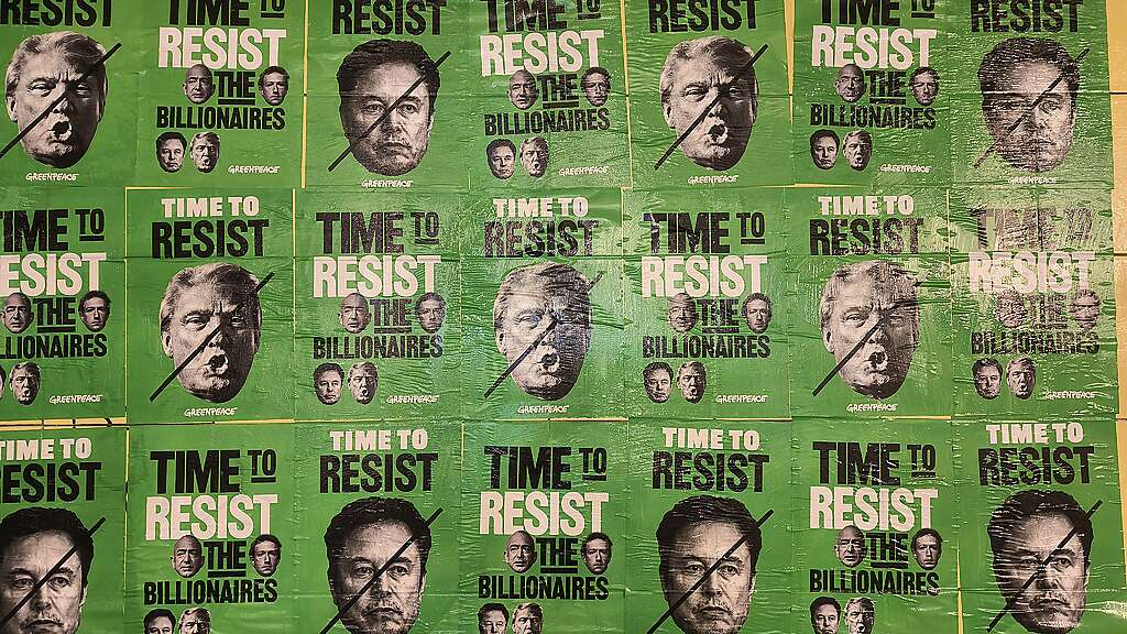 Posters show the portrait of Donald Trump and Elon Musk and the text "Time to Resist".