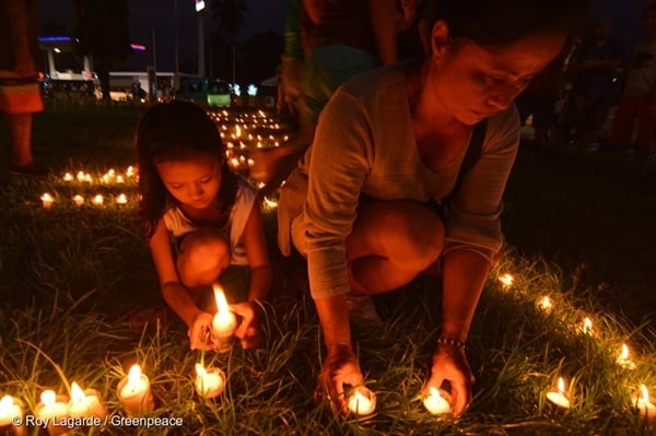 On the eve of the Super Typhoon Haiyan's 3rd year anniversary, people from Tacloban light a candle that spells out "Climate Justice" to commemorate the devastating landfall three years ago. On the eve of the Super Typhoon Haiyan's 3rd year anniversary, people from Tacloban light a candle that spells out "Climate Justice" to commemorate the devastating landfall three years ago.