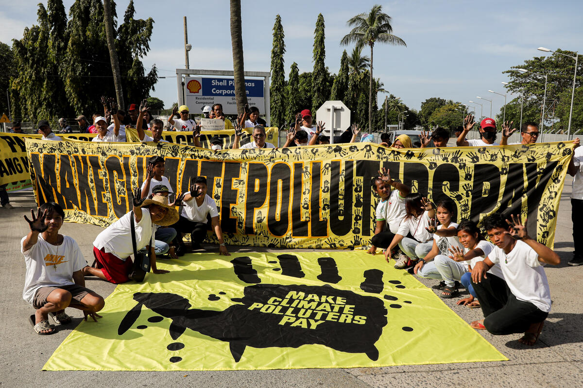 Communities march to Shell terminal, demand fossil fuel industry to ‘pay up’ for climate loss and damage