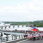 Yolanda survivors walk the last stretch of the Climate Justice Walk 2023 in Tacloban