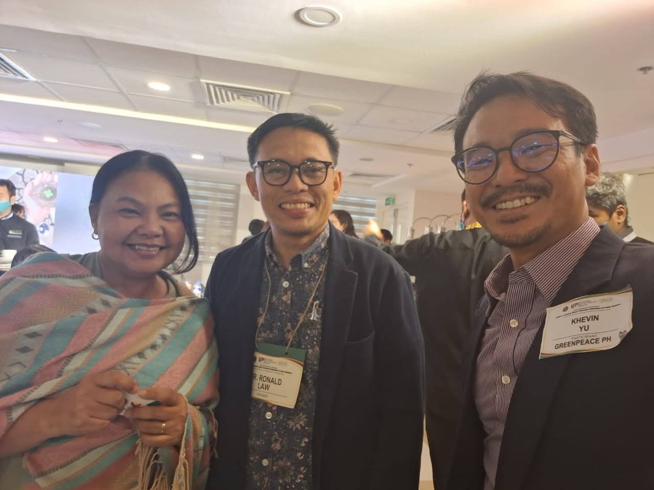 Dr. Ronald Law, Head of the Climate Change Unit of the Department of Health with Greenpeace Campaigners Virginia Benosa-Llorin and Khevin Yu