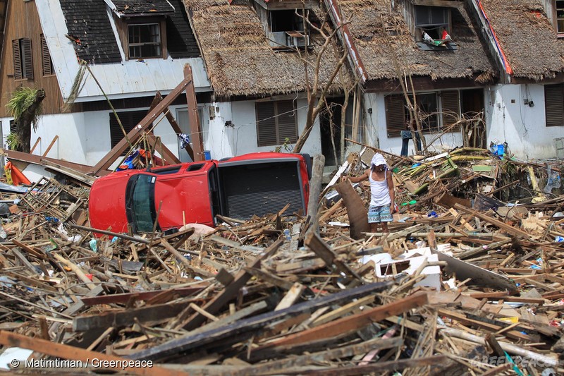 A man sifts thru rubbles looking for salvageable items in Tacloban City after it was hit by super typhoon Haiyan last Saturday.