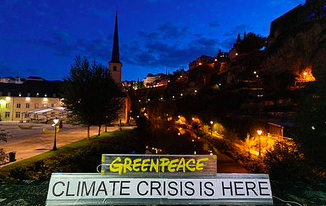 Greenpeace logga med texten climate crisis is here