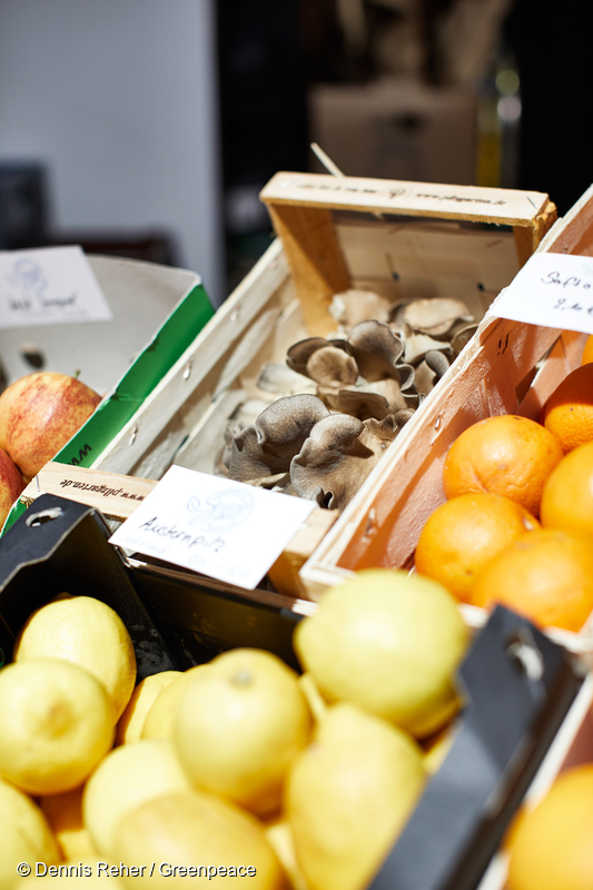 Lemons and oranges stored in boxes.