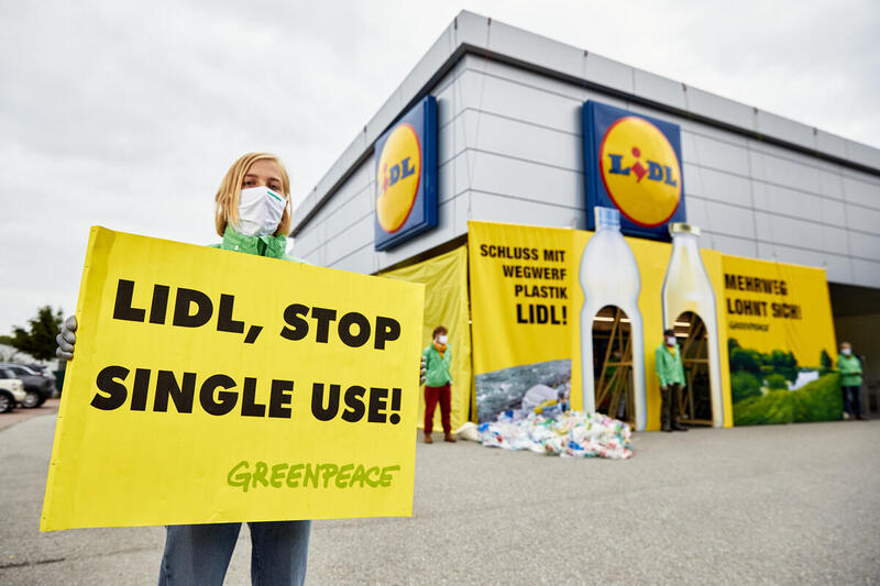 Greenpeace activist protesting against single-use plastic at Lidl store in Salzburg, Austria. Greenpeace activist protesting against single-use plastic at Lidl store in Salzburg, Austria.