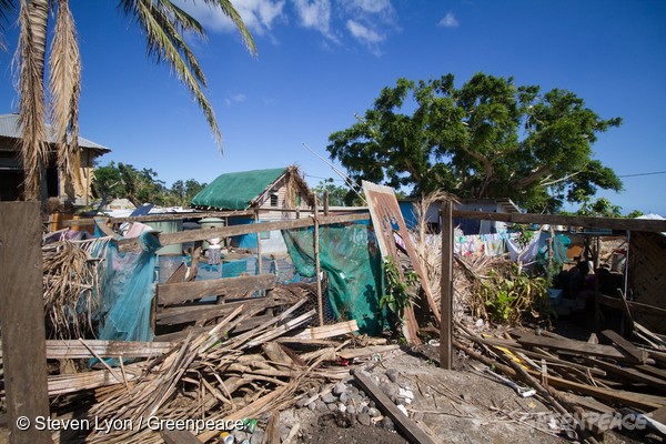21st May 2015. Tanna Island, Vanuatu. Houses and structures on the Island show the damage from the Cyclone.The Rainbow Warrior anchors offshore while RHIBs (Rigid-hulled Inflatable Boats) deliver goods to the outer Island of Vanuatu. Extreme weather events, such as Cyclone Pam, threaten to become the new normal for Pacific island states as the global climate changes, underscoring the urgency to cut global emissions to avert a climate crisis.