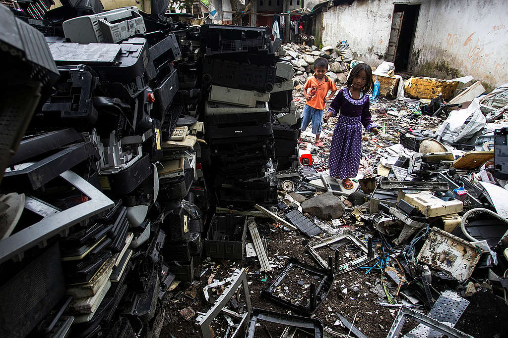 Children Playing between Electronic Waste in Jombang. © Fully Syafi / Greenpeace