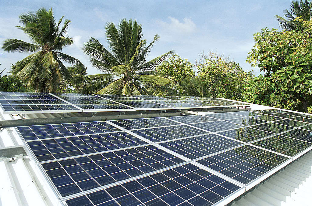 Solar panels on refrigeration plant (for keeping fish fresh). Likiep Atoll, Marshall Islands. © Greenpeace / Steve Morgan