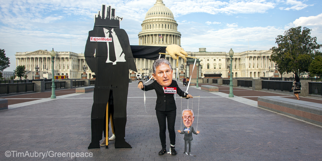 Greenpeace US activists bring to life how ExxonMobil controls puppets like Senator Joe Manchin and in turn how Manchin pulls the strings on Senate Majority Leader Chuck Schumer in front of the Capitol. Fossil fuel companies like Exxon Mobil control puppets.