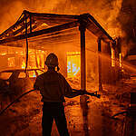 Firefighters battle the Eaton Fire on January 8, 2025 in Altadena, California.. Powerful Santa Ana winds pushed the fire across more than 10,000 acres in less than 24 hours, destroying potentially hundreds of homes and killing five people so far. At least 1,000 structures have burned and 70,000 people are forced from their homes in the Los Angeles area as multiple dangerous wildfires continue to erupt., 8.25.02.LA Wildfires.4123