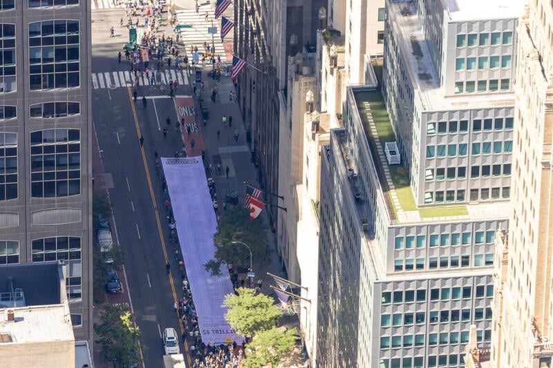 Greenpeace USA unveils giant “bill” with the economic damages brought on by five major oil and gas companies at NYC Climate Week