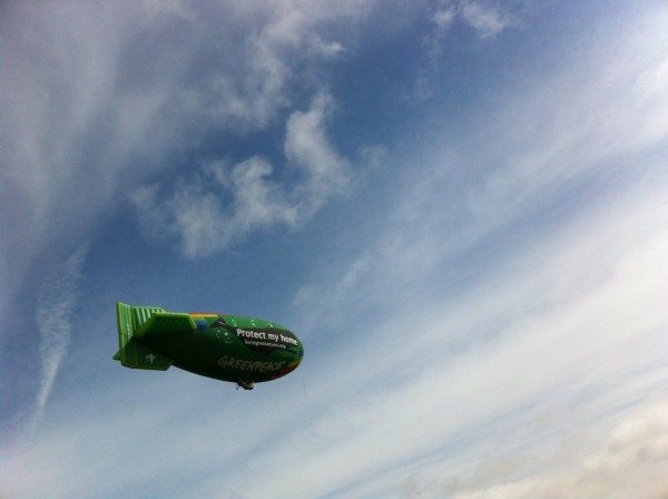 Greenpeace's thermal airship, A.E. Bates, flies over Seattle, a fishing industry hub, to call attention for Bering Sea protection.