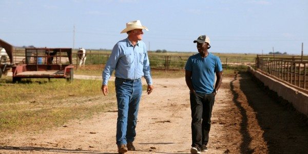 Don Cheadle talks to a farmer suffering drought in Plainview, TX.