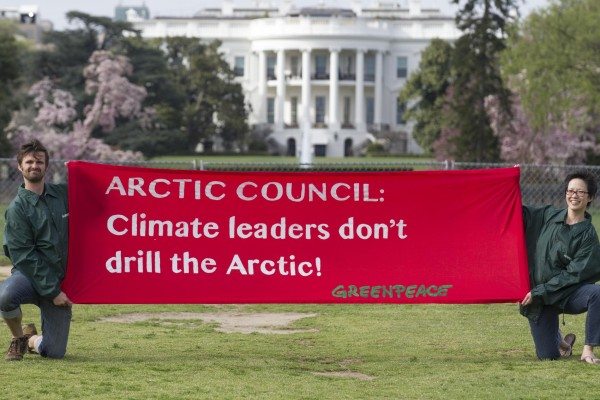 Greenpeace members hold a banner in front of the White House to remind the Arctic Council that oil drilling in the region goes against its inaugural mandate of environmental protection and sustainable development. 