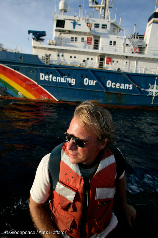 Photo: Bill Richardson of Greenpeace USA ride past the Greenpeace vessel 'MY Esperanza' on the Pacific Leg of the Greenpeace 'Defending Our Oceans' global expedition. Yellow Fin and Big Eye tuna stocks in the Central and Western Pacific are destined to be critically over-fished within three years if the relentless fishing of the two Tuna species continues at current rates. Greenpeace are calling for an immediate end to pirate fishing, a 50% reduction in the amount of Pacific tuna caught, and a global network of Marine Reserves.